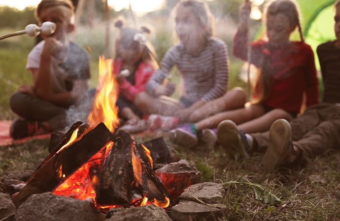 children around a campfire