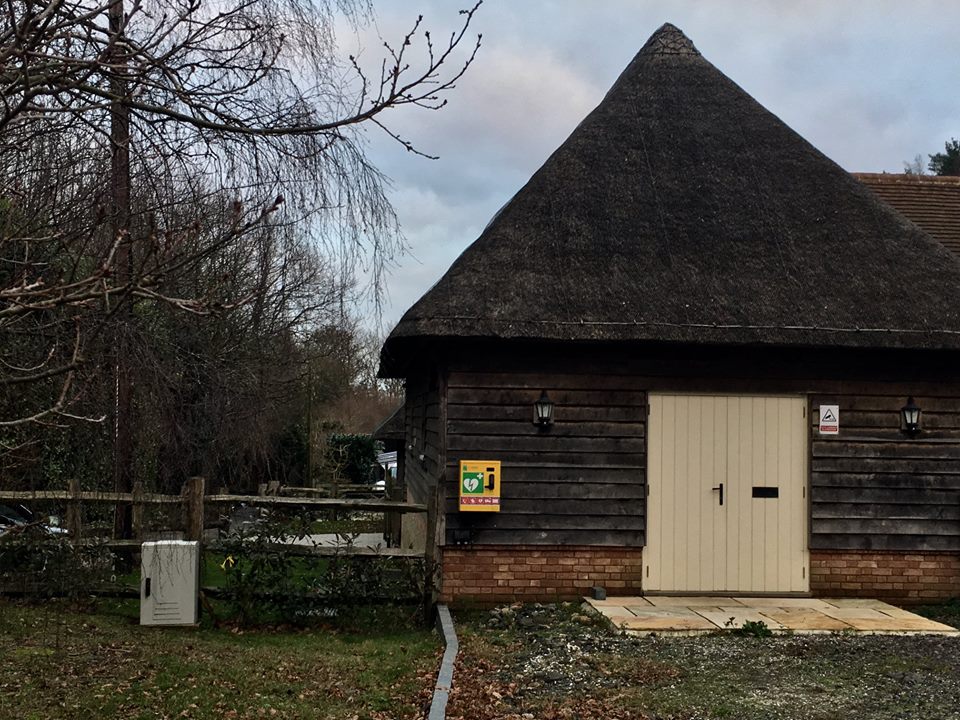 Defibrillator on private house wall